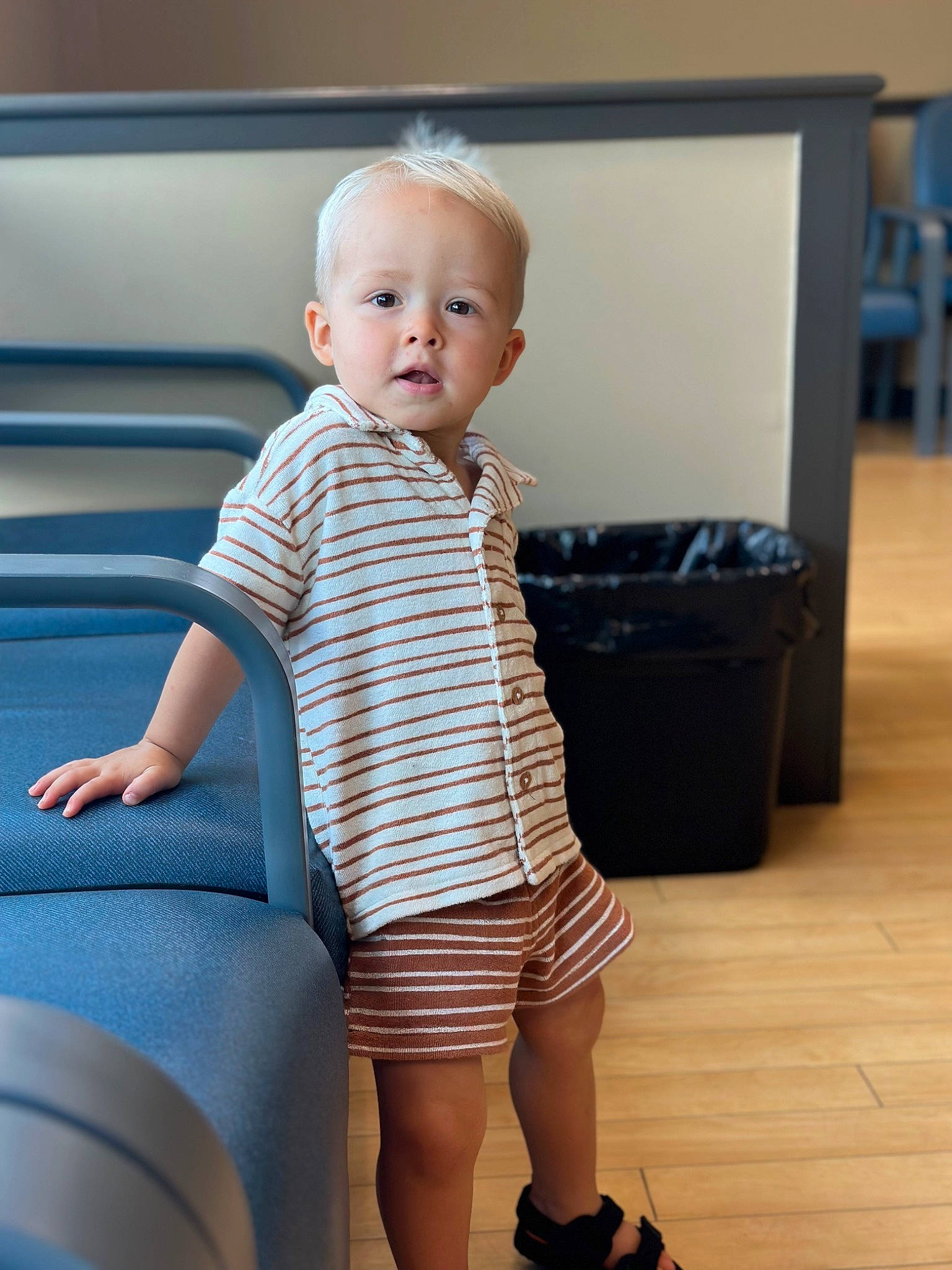 Keelan joined the competition — help win amazing prizes! baby, baby_toddler_clothing, child, comfort, electric_blue, flooring, hardwood, human_leg, joint, knee, luggage_and_bags, person, sandal, shorts, sitting, sleeve, standing, t_shirt, thigh, toddler