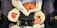 Liam joined the competition — help win amazing prizes! baby, newborn, infant, sleeping, car_seat, seat_harness, buckle, fuzzy_suit, hood, beanie, hands, cozy, blanket, safety_label, warning_label, pacifier_clip, transport, closeup, portrait, adorable