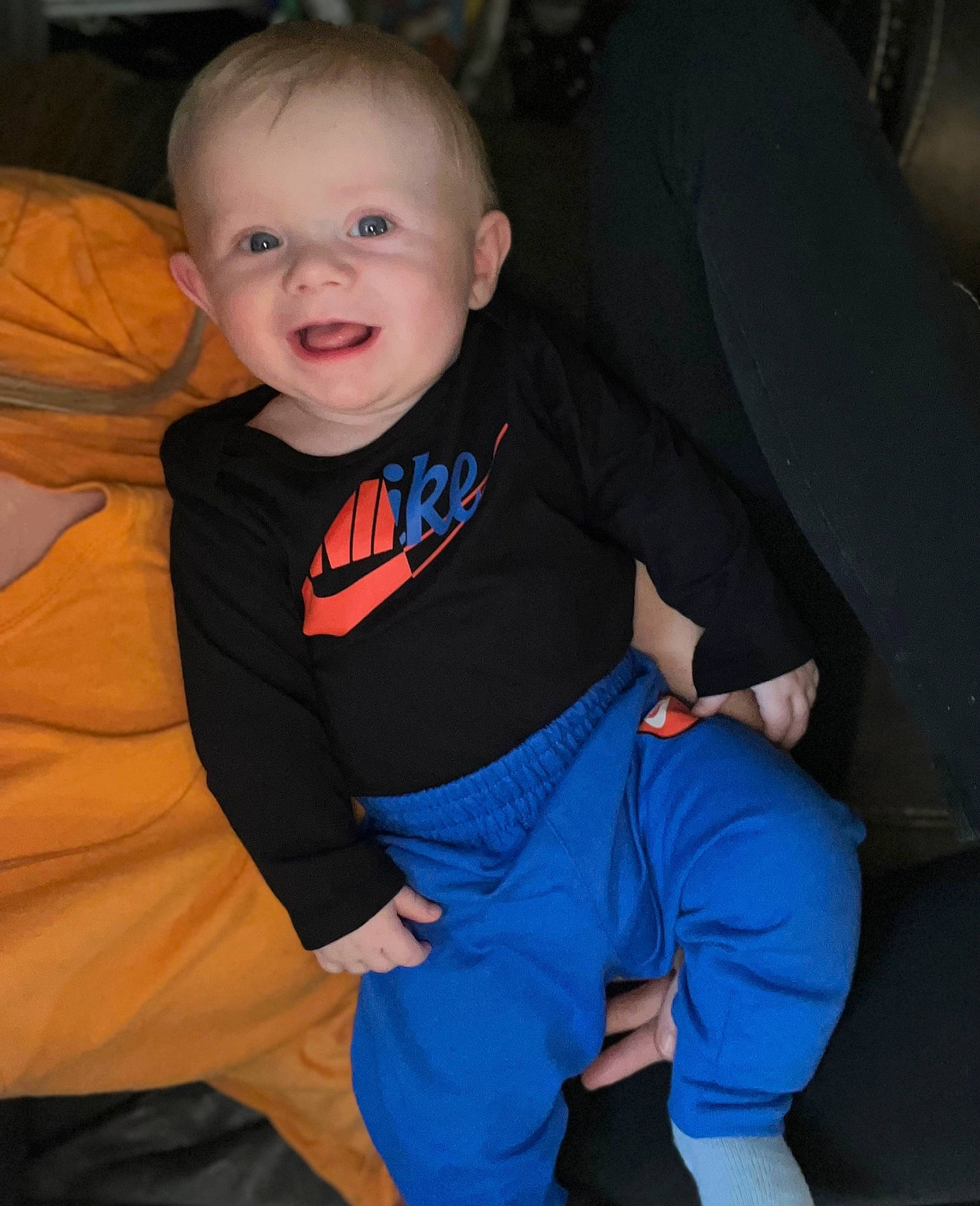 Ryker is registered to the contest to win money with this photo: baby, baby_toddler_clothing, child, comfort, cool, electric_blue, eye, finger, hairstyle, hand, happy, head, human_body, joint, leg, person, sleeve, smile, t_shirt, textile