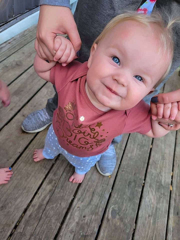 Ariah joined the competition — help win amazing prizes! baby_toddler_clothing, cheek, eye, finger, gesture, grass, hair, hand, happy, head, leaf, leg, lip, nose, person, pink, plant, skin, smile, thumb