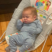 Bryden joined the competition — help win amazing prizes! baby, sleeping, pajamas, rocker, infant, cute, child, wooden_floor, indoors, peaceful, face, hand, foot, clothing, pattern, animal_print, rainbow, toy, comfort, resting