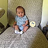 Bryden is registered to the contest to win money with this photo: baby, infant, child, sitting, chair, clothing, onesie, socks, indoor, milestone, sign, age, cute, portrait, person, smile, texture, fabric, cozy, home