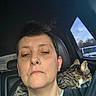 Beo is registered to the contest to win money with this photo: animal, black_shirt, car_interior, cat, clothing, daylight, earrings, face, head, lip_piercing, looking_out, person, pet, seat, selfie, short_hair, side_view, tabby_cat, vehicle, window