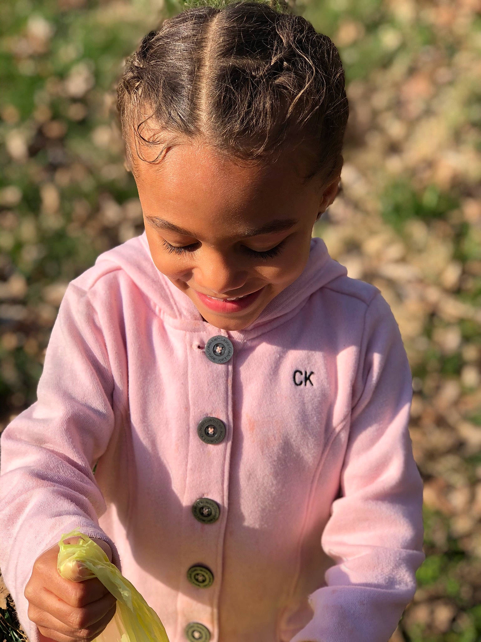 Myah is registered to the contest to win money with this photo: arm, baby, baby_toddler_clothing, botany, button, child, fun, grass, hand, happy, leaf, lip, nose, outerwear, people_in_nature, person, plant, skin, sleeve, smile