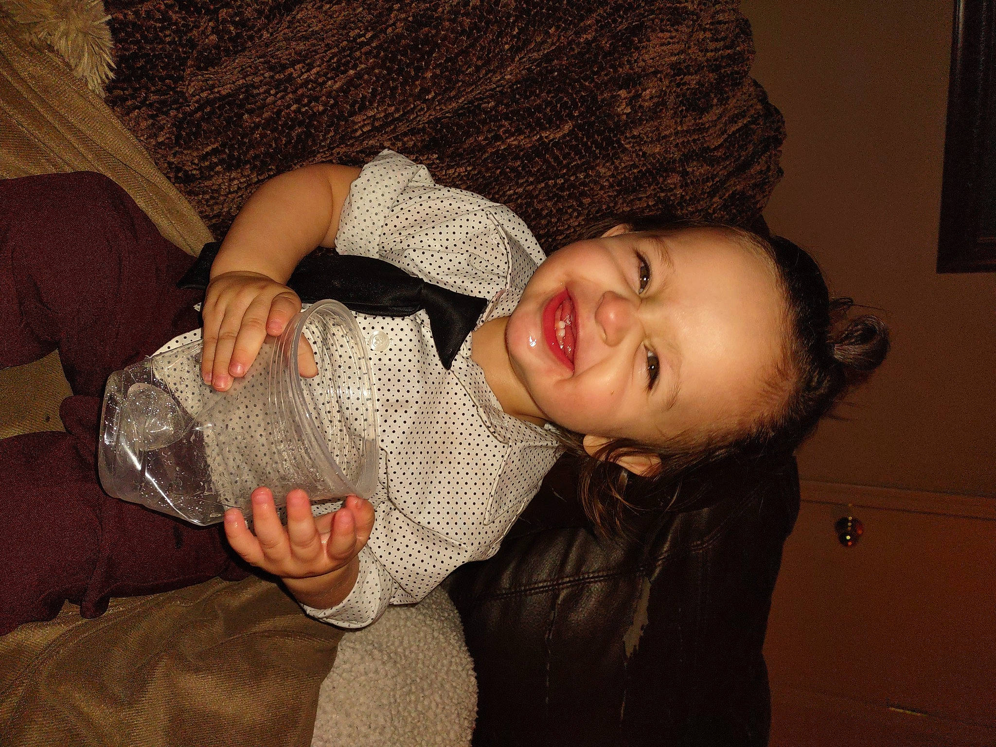 Monroe is registered to the contest to win money with this photo: cap, comfort, cool, eye, finger, flash_photography, fun, gesture, happy, human_body, mammal, mouth, neck, nose, person, picture_frame, skin, smile, thumb, toddler