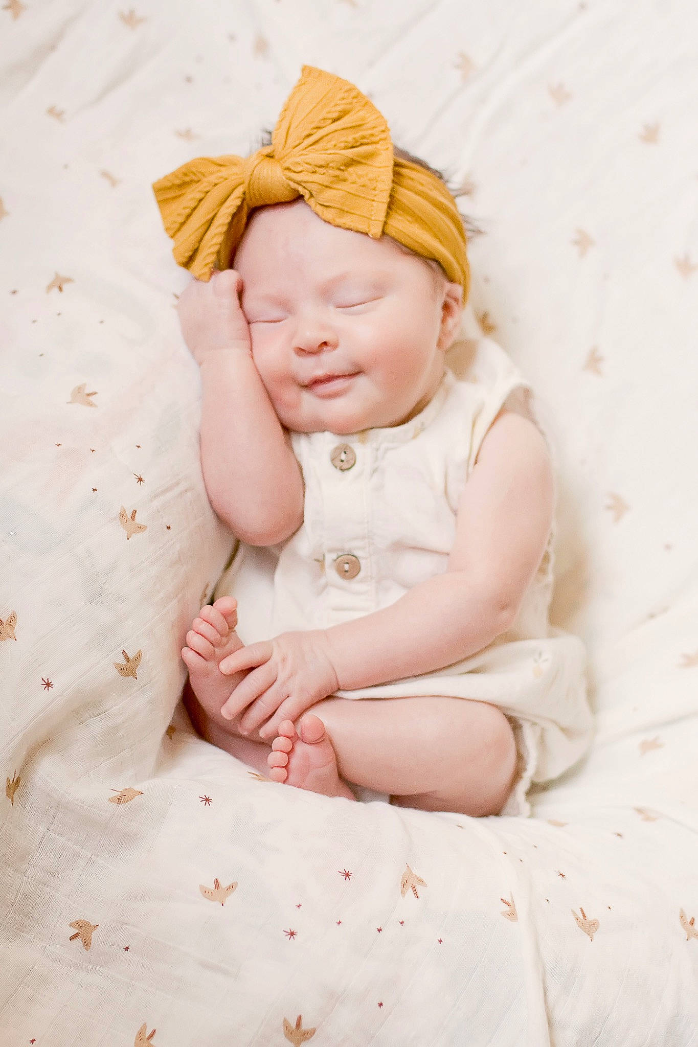 Leona is registered to the contest to win money with this photo: baby, baby_sleeping, baby_toddler_clothing, child, comfort, fashion_accessory, grass, linens, pattern, peach, person, pink, portrait_photography, sitting, skin, sleeve, textile, toddler, towel, wood