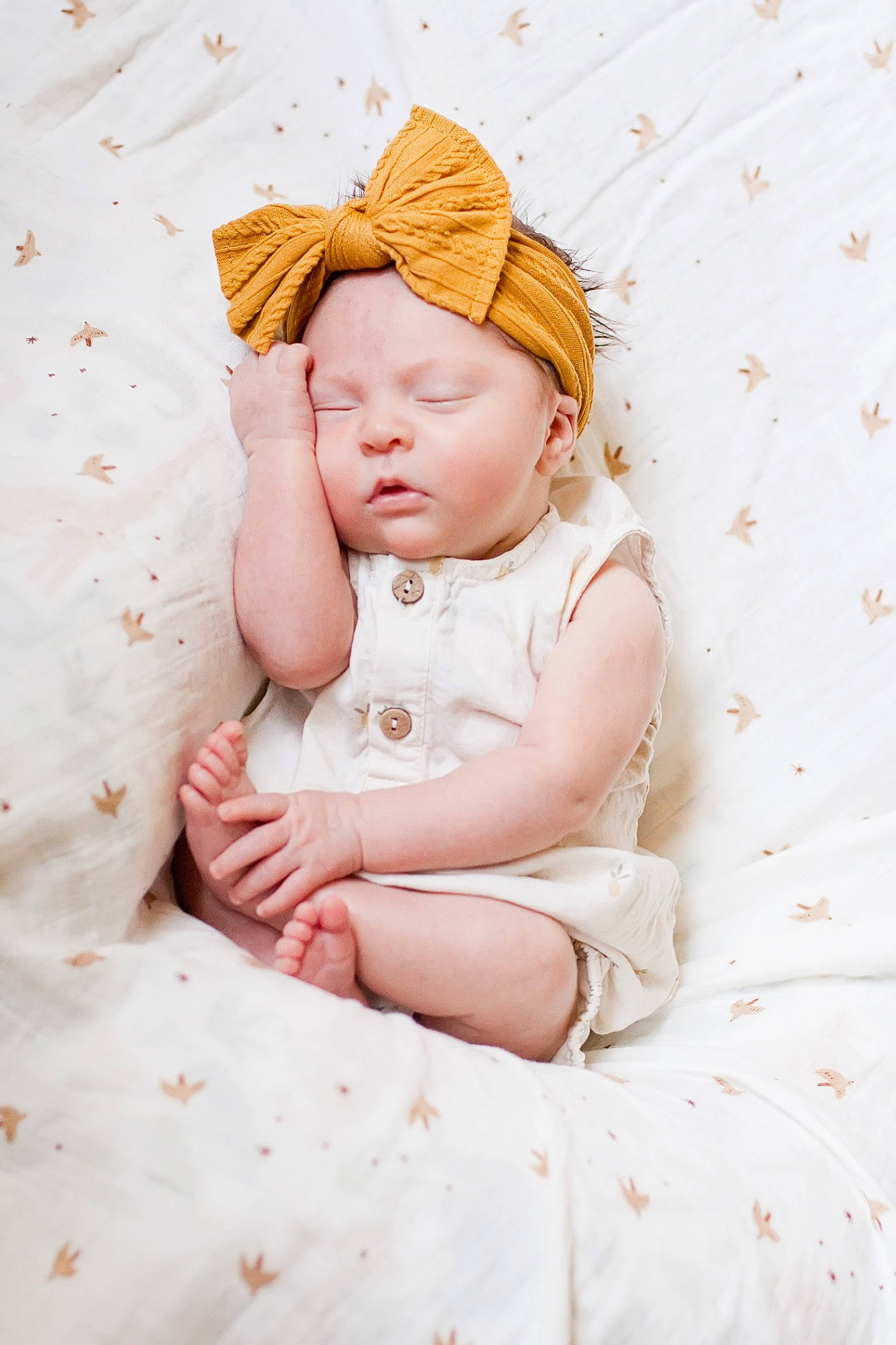 Leona is registered to the contest to win money with this photo: baby, baby_sleeping, baby_toddler_clothing, cheek, child, comfort, eye, fashion_accessory, grass, hand, linens, pattern, peach, person, pink, sitting, skin, sleeve, sun_hat, textile