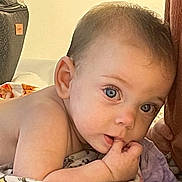 Ivy is registered to the contest to win money with this photo: baby, child, infant, skin, face, eyes, hand, blanket, lying, tummy, curious, indoors, soft, cozy, expression, cute, person, young, closeup, portrait