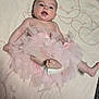Lola a rejoint le concours — aidez-le/la à gagner de superbes lots ! baby, infant, tutu, pink, blanket, animal_sketch, cute, smiling, lying_down, soft_texture, foot, hand, head, skin, happy, child, newborn, indoors, clothing, portrait
