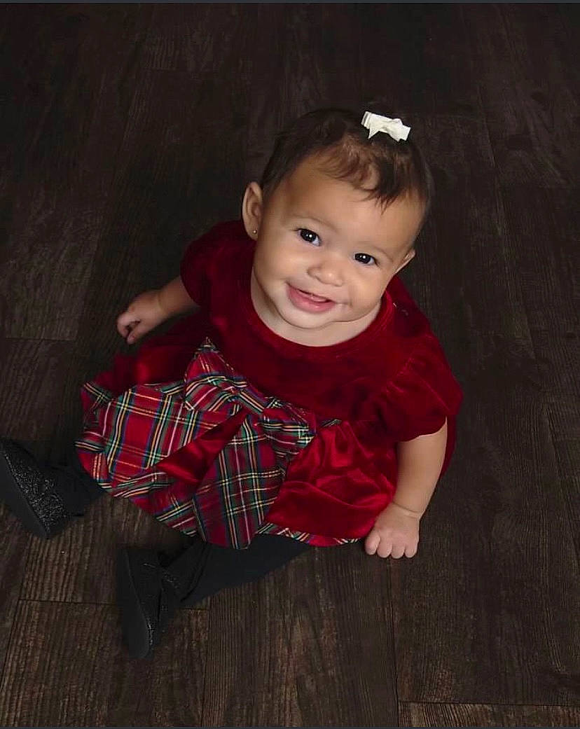Ryleigh is registered to the contest to win money with this photo: baby, baby_toddler_clothing, brown, cheek, child, flash_photography, floor, flooring, happy, hardwood, iris, joy, nose, pattern, person, skin, sleeve, smile, t_shirt, toddler