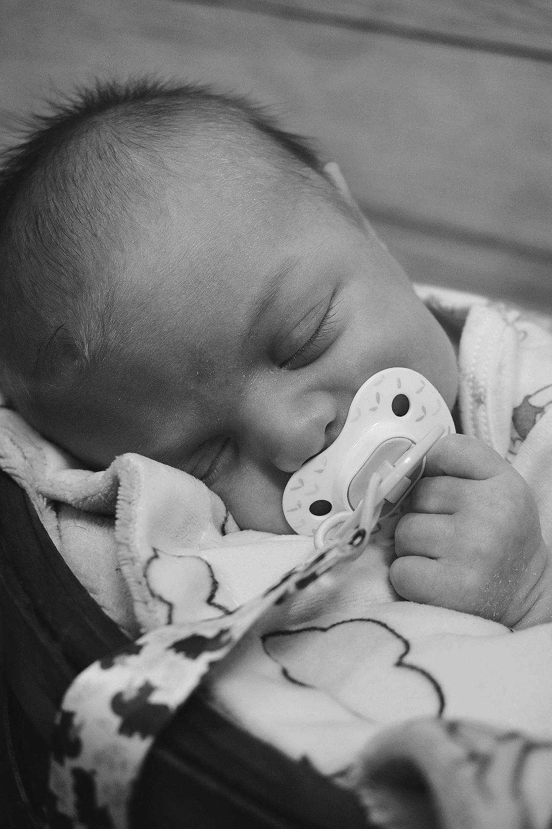 Ezeakial is registered to the contest to win money with this photo: baby, baby_toddler_clothing, cheek, chin, close_up, comfort, ear, eye, eyebrow, eyelash, gesture, happy, human_body, iris, monochrome, monochrome_photography, mouth, nose, person, skin