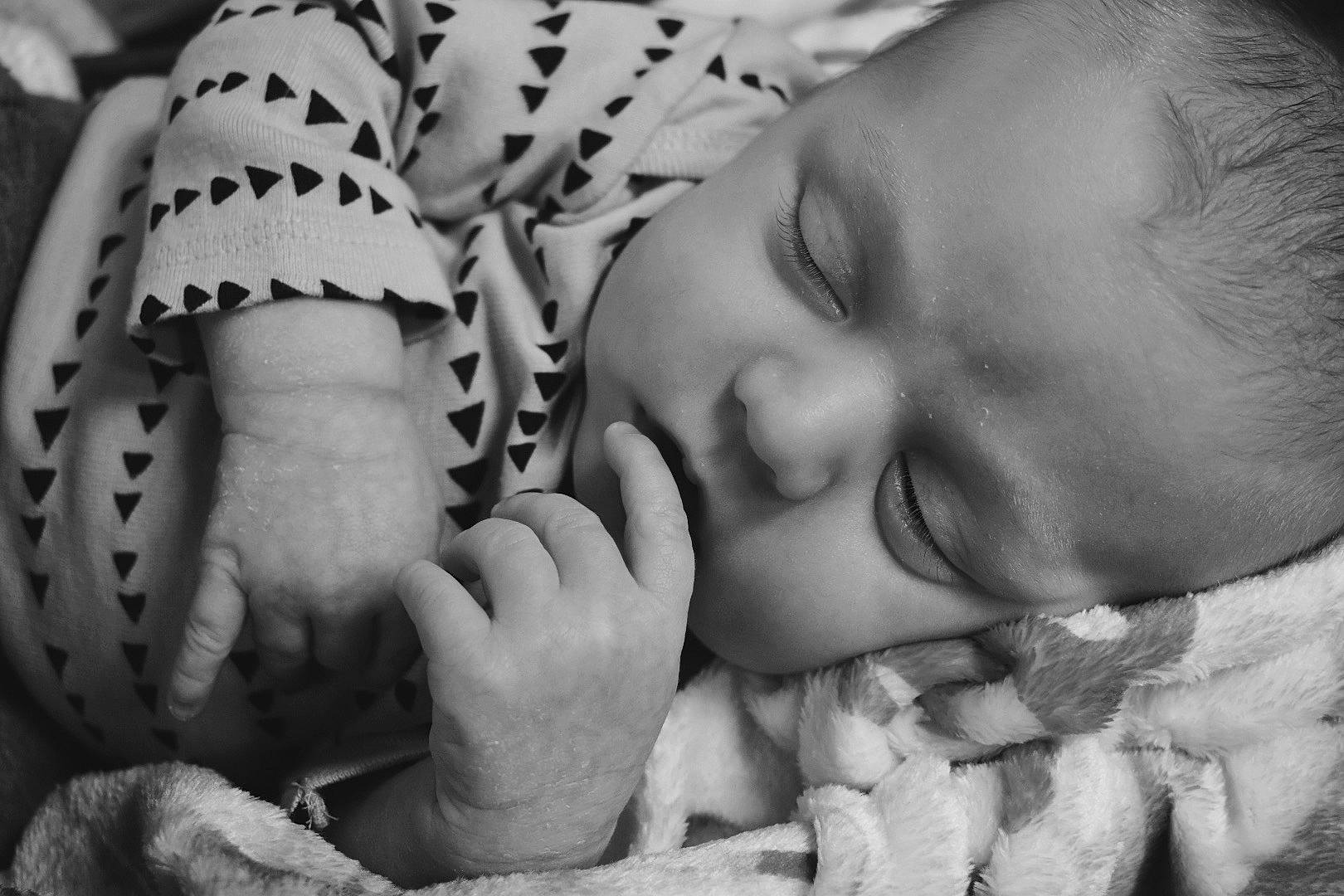 Ezeakial is registered to the contest to win money with this photo: baby, black, black_and_white, comfort, finger, gesture, hand, happy, human, human_body, mammal, mouth, nose, organ, person, photograph, product, skin, smile, style