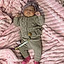 baby, sleeping, blanket, pink, knitwear, headband, pacifier, beads, clothing, child, soft_texture, cute, infant, lying_down, cozy, portrait, indoor, warm, comfortable, peaceful