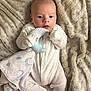 Theo joined the competition — help win amazing prizes! baby, infant, onesie, blanket, plush_toy, moon, soft_texture, sleepwear, cute, lying_down, cozy, indoor, newborn, child, comfort, fabric, warm, small_hands, blue_eyes, peaceful
