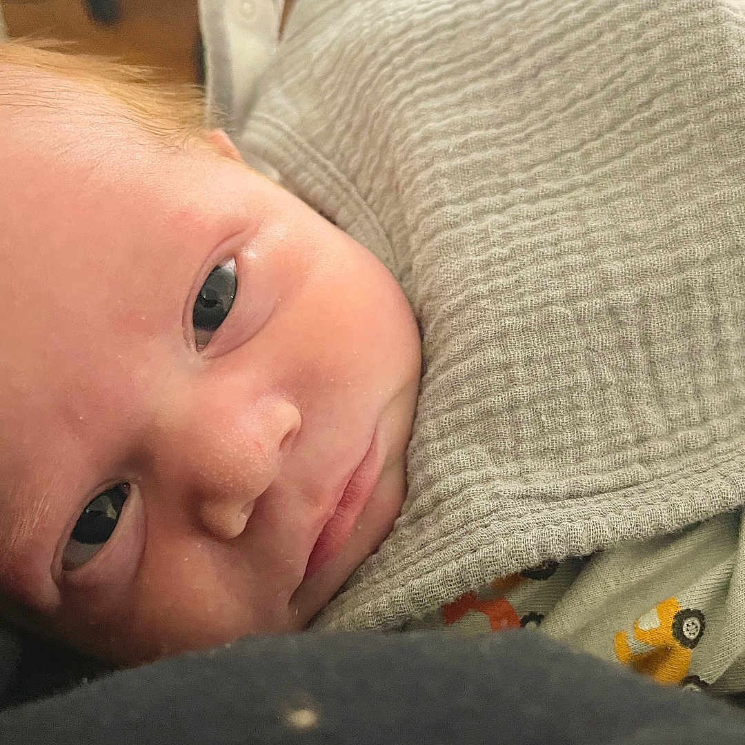Brayden is registered to the contest to win money with this photo: baby, beanie, bodypart, bonnet, cap, clothing, face, finger, hand, hat, head, hood, hoodie, knitwear, newborn, person, photography, portrait, sweater, sweatshirt