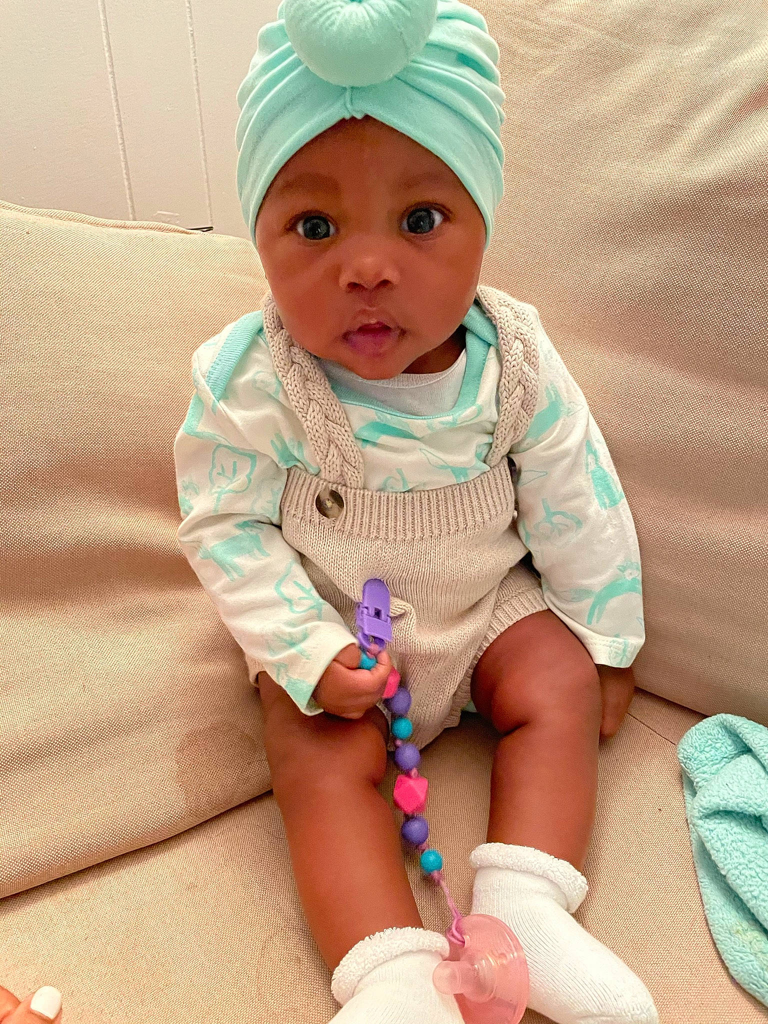 Kara is registered to the contest to win money with this photo: baby, baby_toddler_clothing, cap, cheek, child, clothing, comfort, eye, face, happy, head, headgear, headwear, magenta, pattern, person, pink, product, skin, sleeve