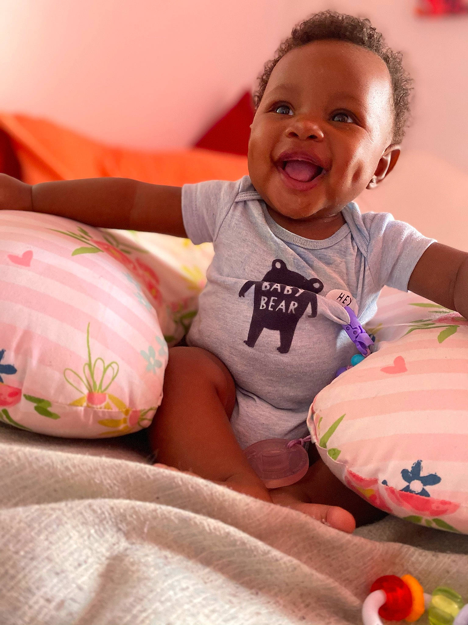 Kara joined the competition — help win amazing prizes! arm, baby_toddler_clothing, cheek, comfort, eye, face, facial_expression, finger, happy, head, human, human_body, joint, leg, mouth, orange, person, pink, skin, smile