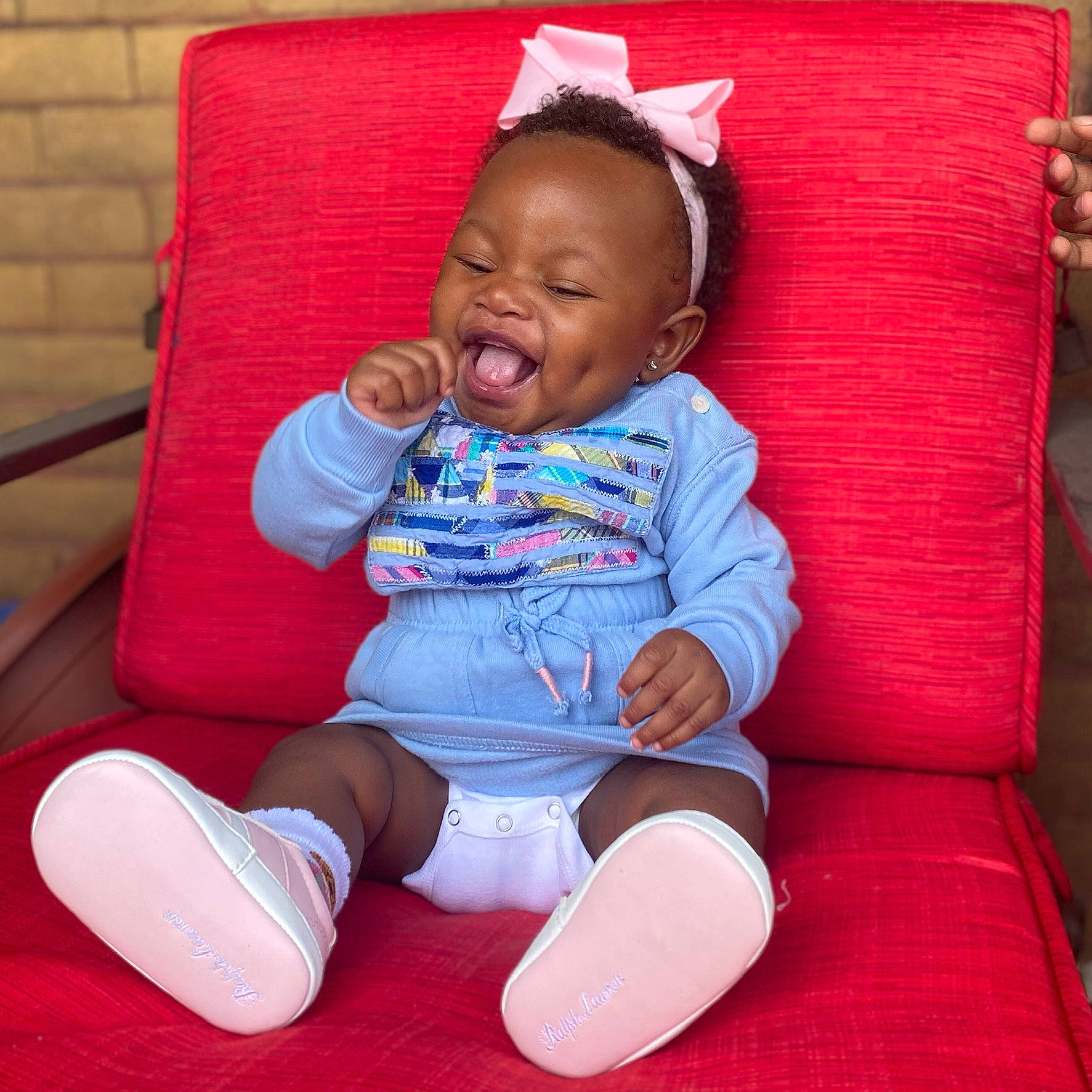 Kara joined the competition — help win amazing prizes! baby, baby_toddler_clothing, cheek, comfort, face, facial_expression, finger, knee, organ, person, pink, product, purple, red, skin, sleeve, smile, sock, textile, thigh