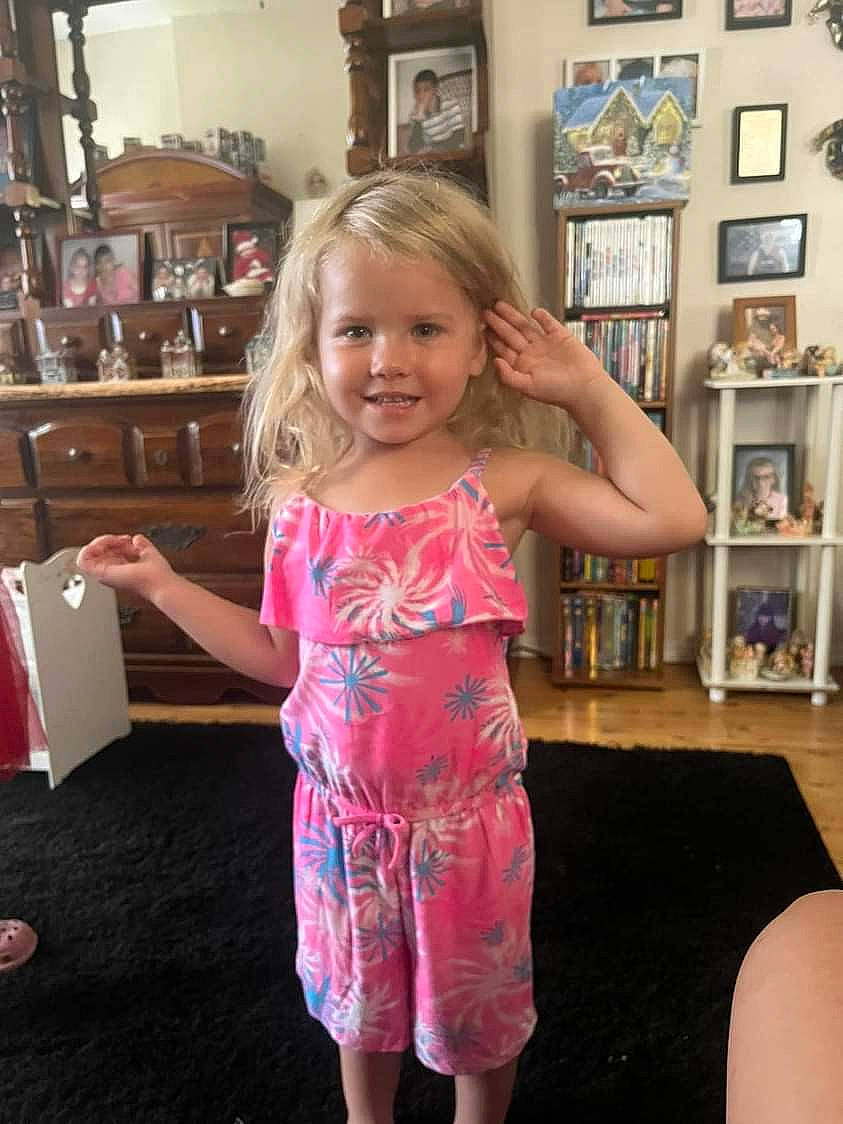 Skylar joined the competition — help win amazing prizes! blond, bookcase, cabinetry, child, fashion, floor, flooring, fun, hair, hairstyle, happy, joint, joy, long_hair, person, picture_frame, shelf, shoulder, smile, standing