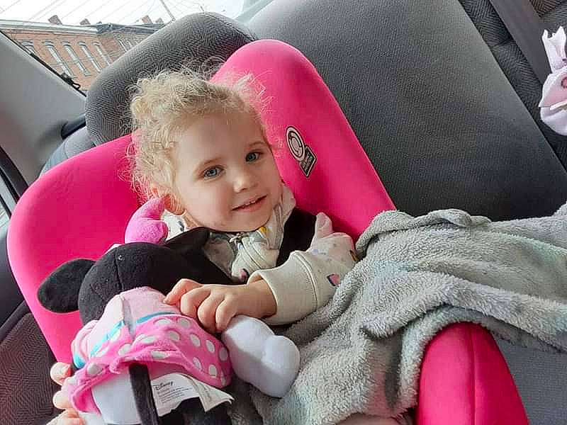 Emmalee is registered to the contest to win money with this photo: auto_part, baby_products, baby_toddler_clothing, car_seat, car_seat_cover, comfort, family_car, fun, happy, head_restraint, joy, leisure, motor_vehicle, person, pink, seat_belt, skin, smile, steering_wheel, toddler