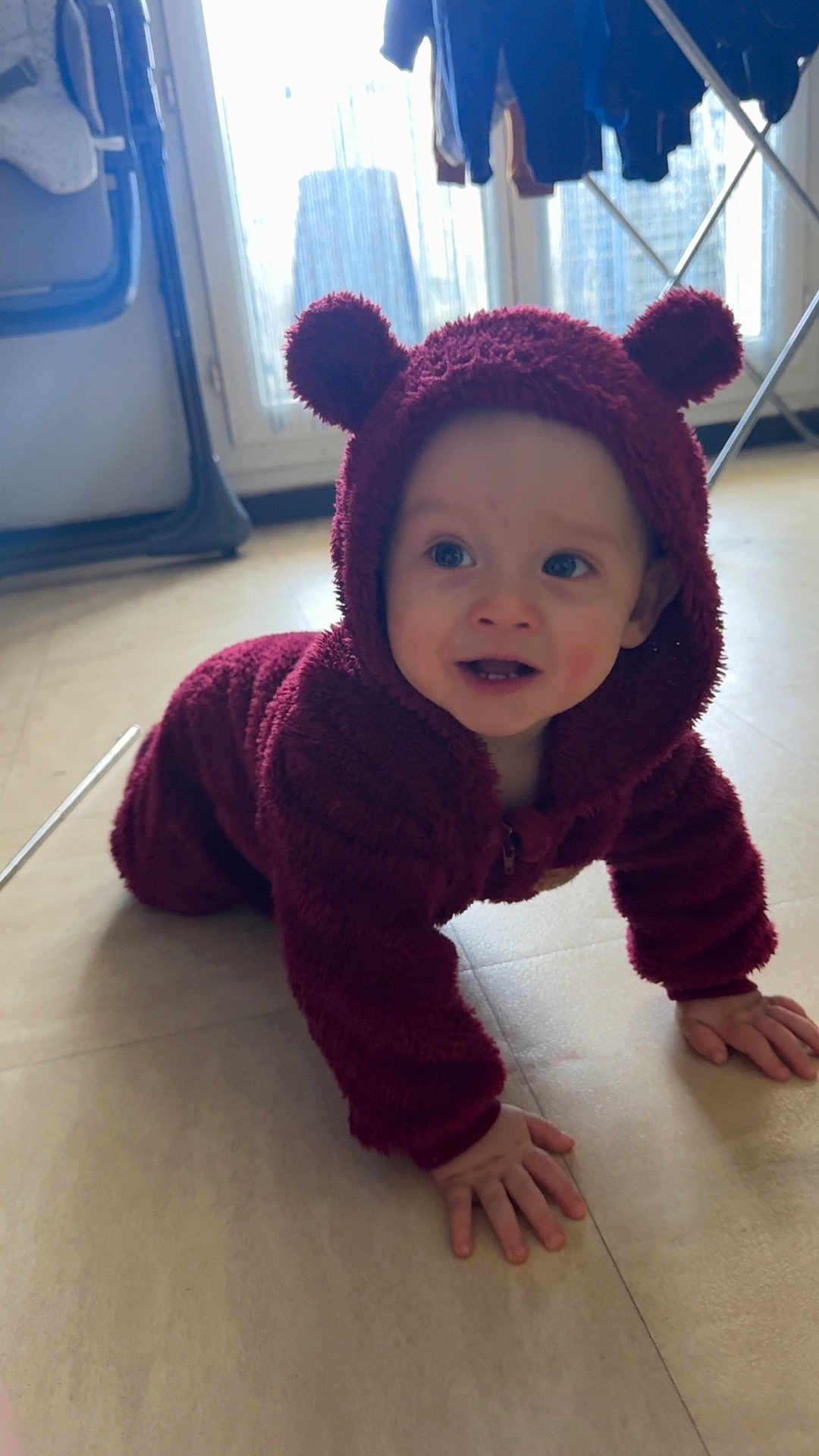 Hayden a rejoint le concours — aidez-le/la à gagner de superbes lots ! baby, child, crawling, hoodie, maroon, indoor, floor, window, light, curious, smile, hand, face, person, infant, cute, clothing, young, warm, cozy