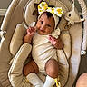 Alaia is registered to the contest to win money with this photo: baby, infant, child, smiling, portrait, bouncer, baby_seat, headband, bow, lemon_pattern, onesie, socks, plush_toy, whale, indoor, nursery, cozy, seated, happy, photography