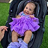 Alaia is registered to the contest to win money with this photo: baby, infant, child, smiling, happy, portrait, car_seat, purple_dress, ruffles, socks, hair_bow, outdoor, artificial_grass, seated, baby_clothing, face, hands, photography, adorable, safe