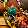 Nyaire joined the competition — help win amazing prizes! newborn, baby, pacifier, sleeping, onesie, hand, infant, cozy, cute, child, face, clothing, rest, comfort, warm, skin, person, babywear, indoor, portrait