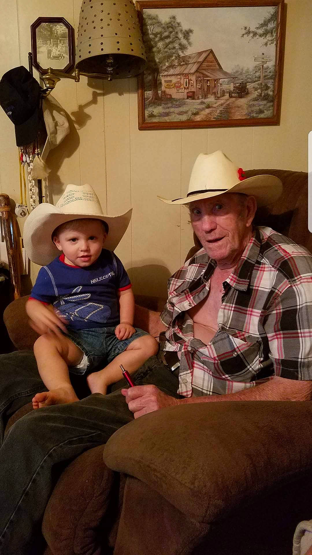 Zaiden joined the competition — help win amazing prizes! cowboy_hat, fashion_accessory, hat, headgear, headwear, lampshade, lighting_accessory, person, sitting