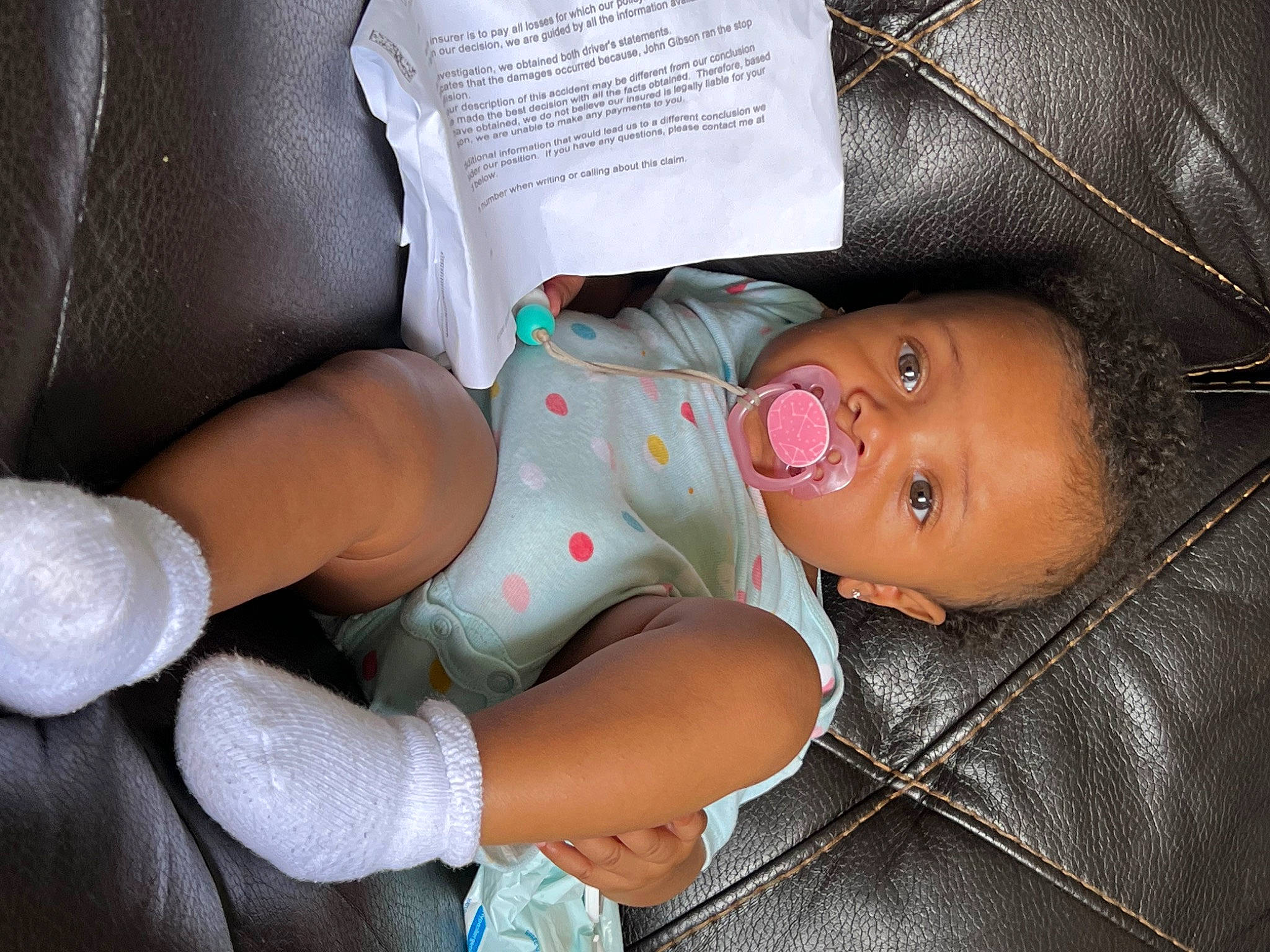 J'Mya Gibson is registered to the contest to win money with this photo: baby, baby_carriage, baby_products, baby_sleeping, baby_toddler_clothing, car_seat, cheek, child, comfort, finger, hand, human_body, joint, leg, mouth, nose, person, skin, smile, textile