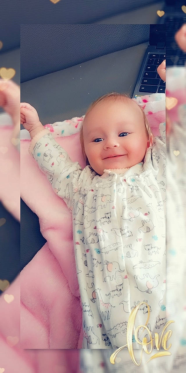 Haizley is registered to the contest to win money with this photo: baby, baby_toddler_clothing, cheek, chin, comfort, eyebrow, eyelash, face, finger, gesture, head, iris, joy, lip, nose, person, pink, product, skin, sleeve