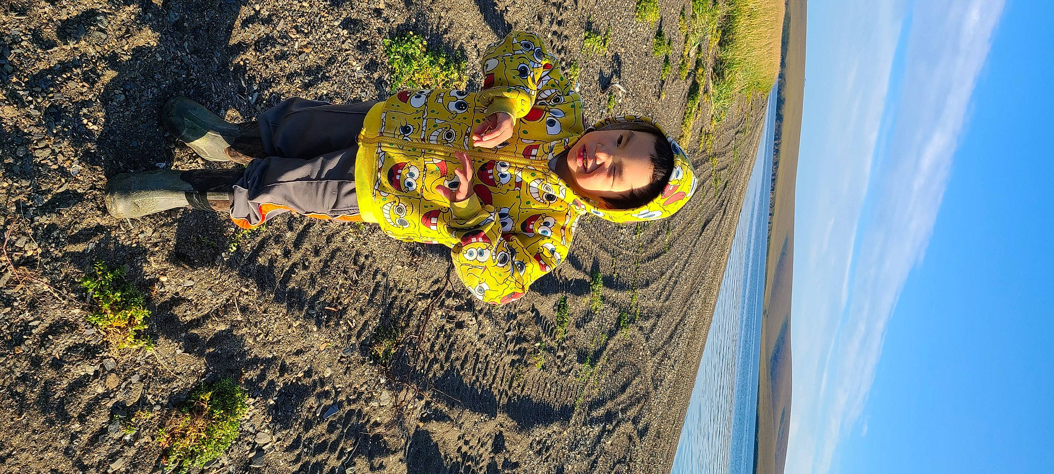 Davis Seetot Olanna is registered to the contest to win money with this photo: art, asphalt, baby, cloud, fun, grass, happy, landscape, leisure, people_in_nature, person, recreation, road_surface, rock, shadow, sky, smile, soil, toddler, water