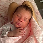 Carmen joined the competition — help win amazing prizes! newborn, baby, sleeping, blanket, pink, soft, wrapped, hand, face, person, legs, cozy, infant, resting, indoors, skin, cute, peaceful, portrait, closeup