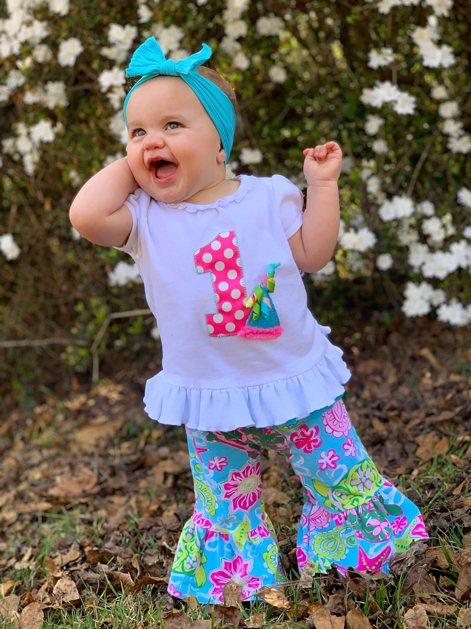 Alaina joined the competition — help win amazing prizes! baby, baby_toddler_clothing, cap, child, electric_blue, fashion_accessory, grass, happy, headwear, leaf, magenta, pattern, people_in_nature, person, photograph, pink, plant, sleeve, smile, spring
