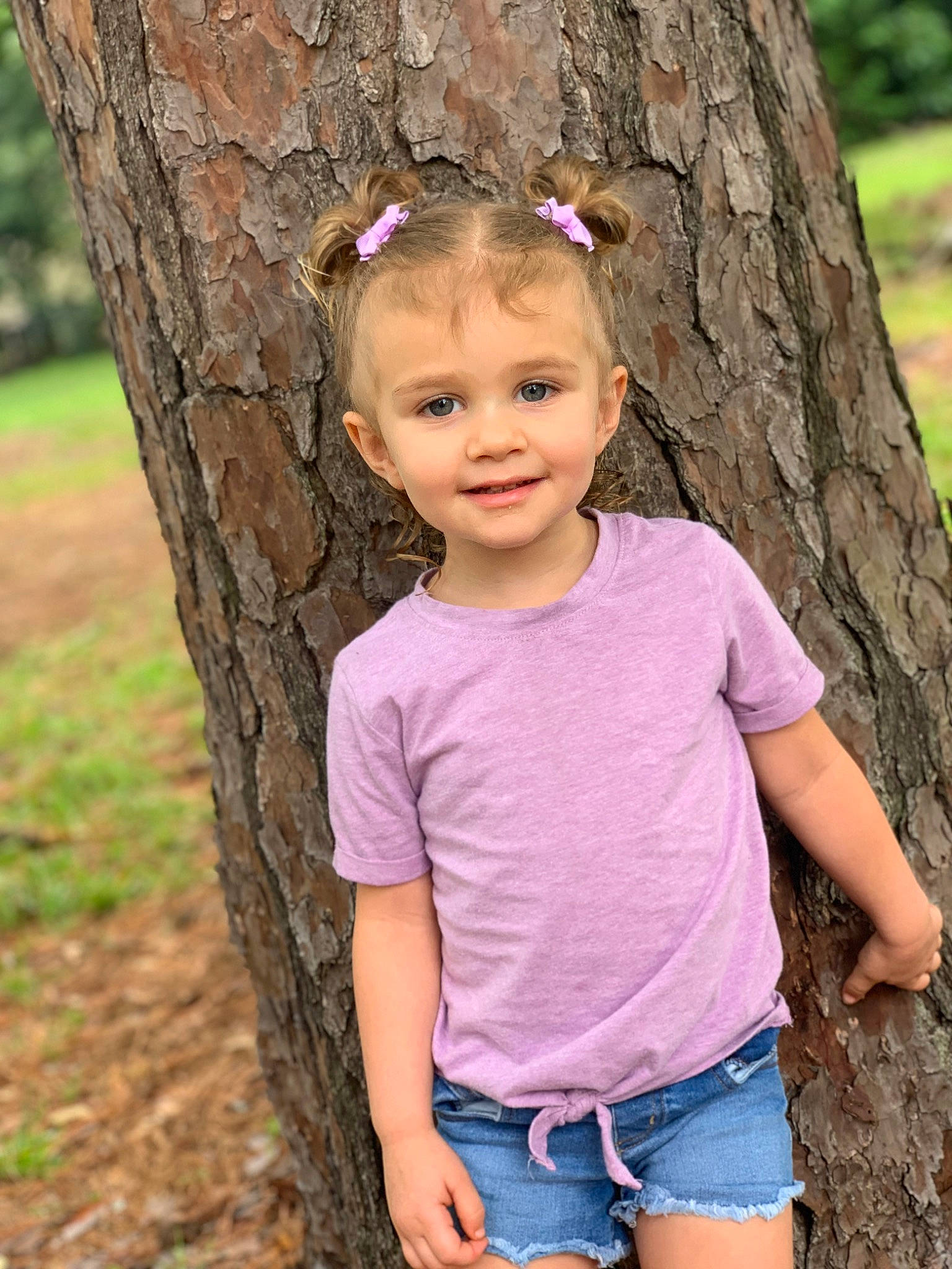 Aubree joined the competition — help win amazing prizes! branch, chin, clothing, eye, face, gesture, hair, happy, head, joy, people_in_nature, person, pink, plant, shoulder, skin, smile, toddler, tree, trunk