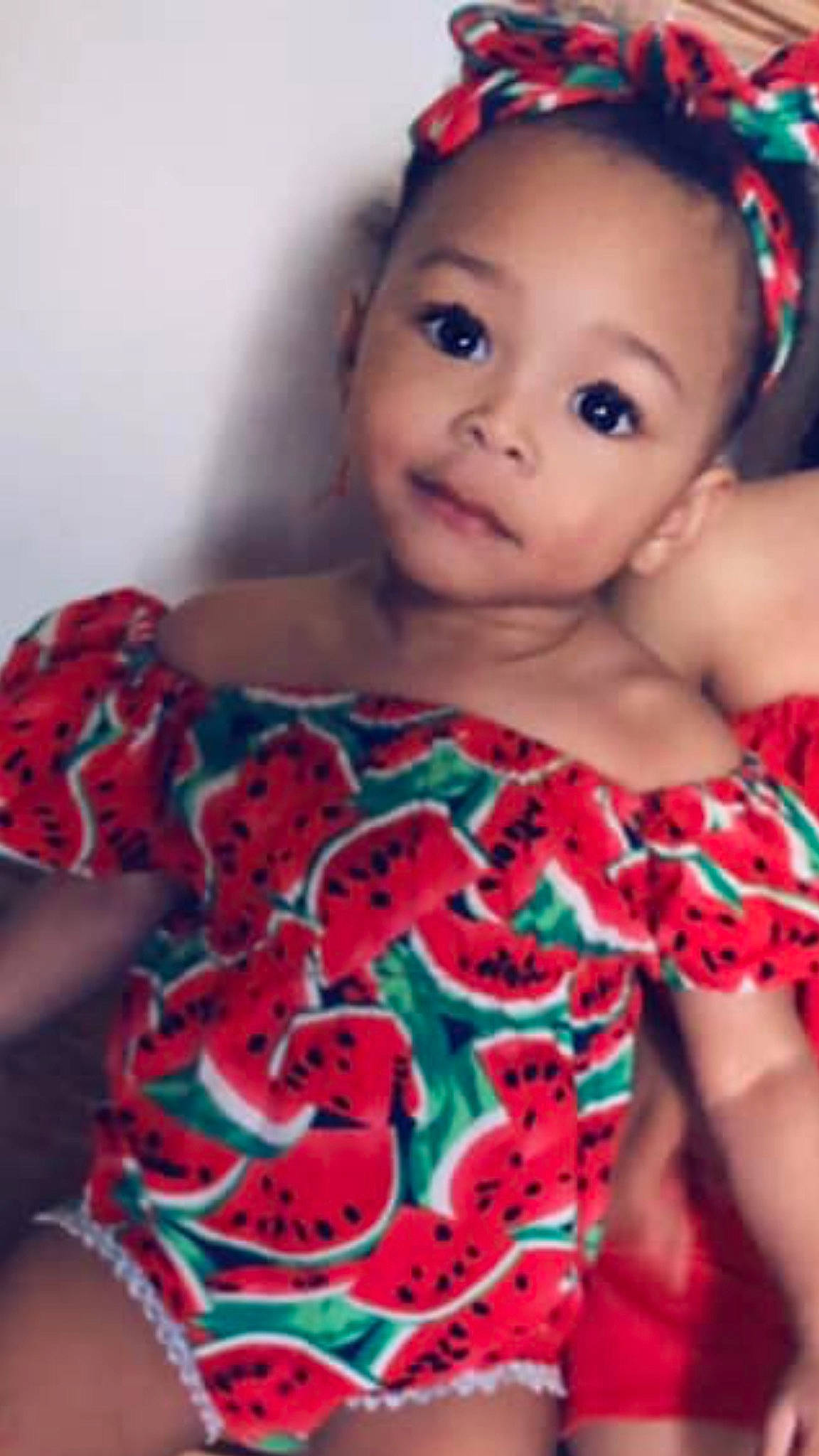 Melia is registered to the contest to win money with this photo: baby, baby_products, baby_toddler_clothing, cheek, child, child_model, face, hair_accessory, head, person, red, skin, smile, textile, toddler