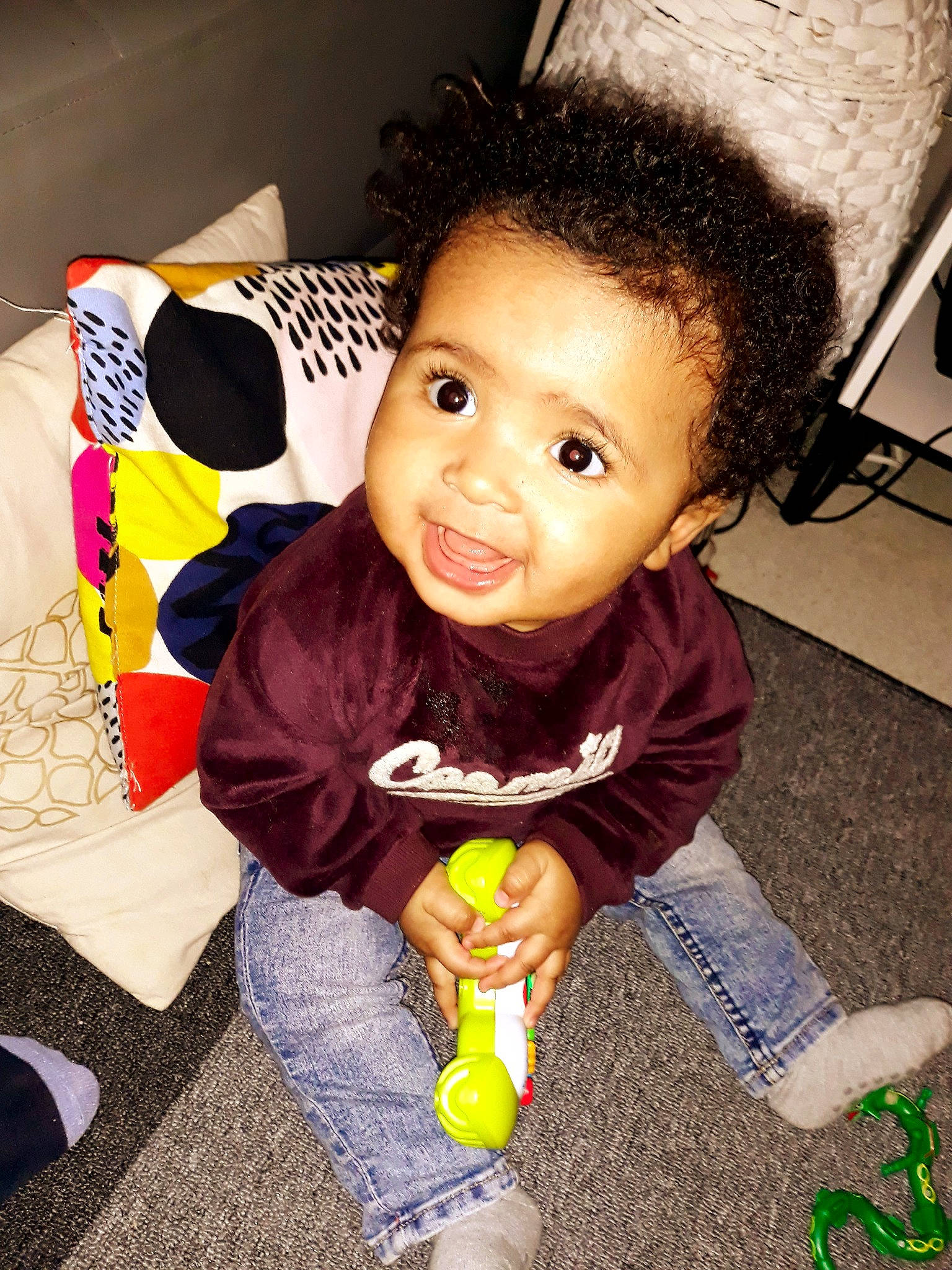 Tidjane participe au concours pour gagner de l'argent avec cette photo : baby, cheek, child, hairstyle, outerwear, person, play, skin, smile, toddler