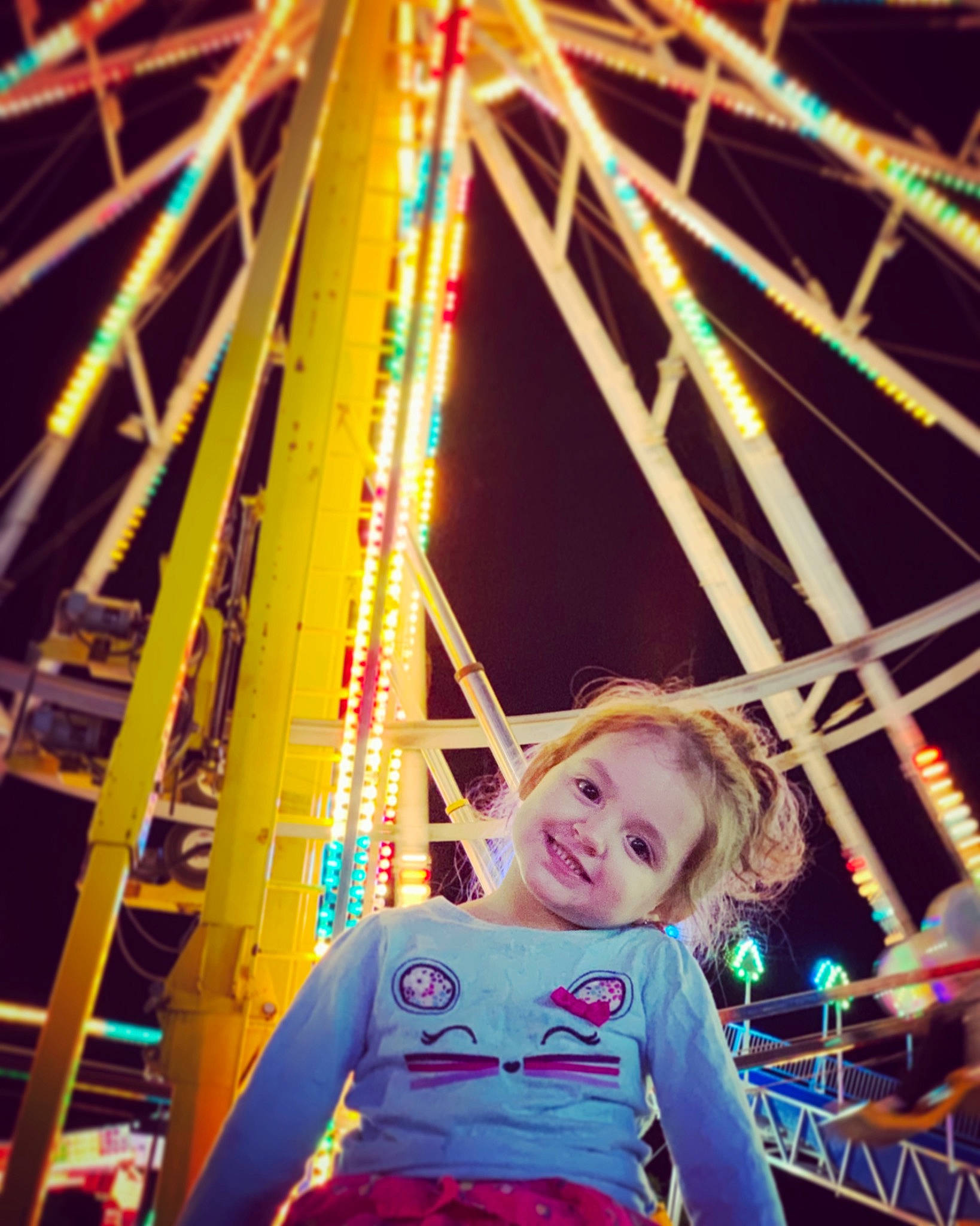 Ezabella is registered to the contest to win money with this photo: amusement_park, amusement_ride, fair, ferris_wheel, fun, joy, leisure, night, nonbuilding_structure, park, person, recreation, tourist_attraction, world