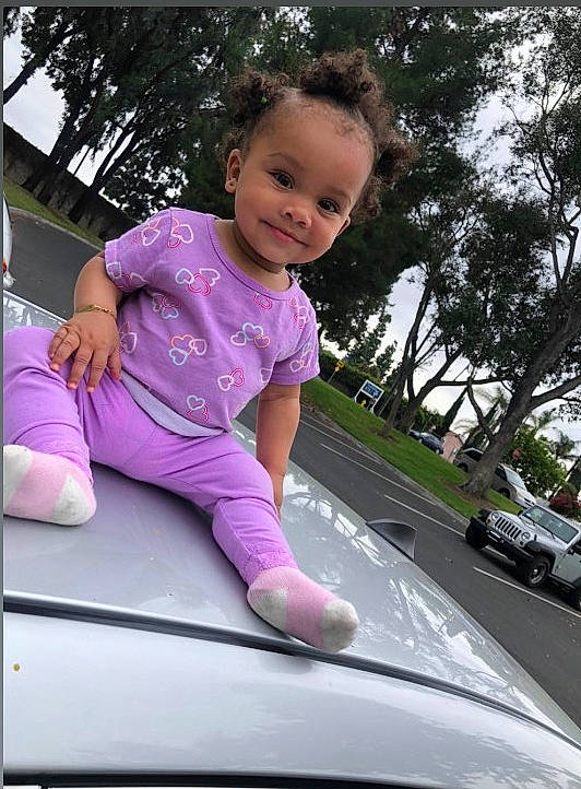 Camiyah is registered to the contest to win money with this photo: auto_part, automotive_exterior, automotive_window_part, car, child, family_car, glass, joy, luxury_vehicle, person, pink, smile, toddler, vehicle, vehicle_door, window, windshield