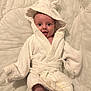 Alaina joined the competition — help win amazing prizes! baby, infant, robe, hooded_robe, white, blanket, smiling, happy, cute, soft_texture, bunny_ears, toddler, child, portrait, cozy, lying_down, clothing, indoors, skin, expression