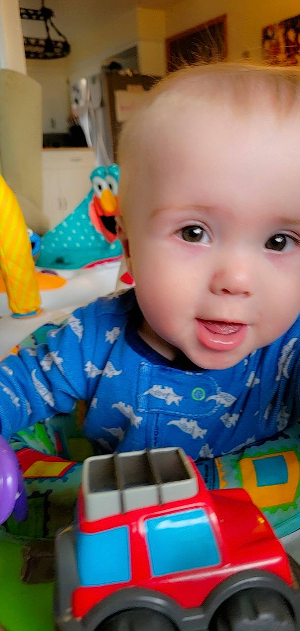 Noah is registered to the contest to win money with this photo: baby, baby_playing_with_toys, baby_products, baby_toddler_clothing, baby_toys, blue, cheek, child, electric_blue, eye, fun, iris, mouth, nose, organ, person, product, smile, snapshot, toddler