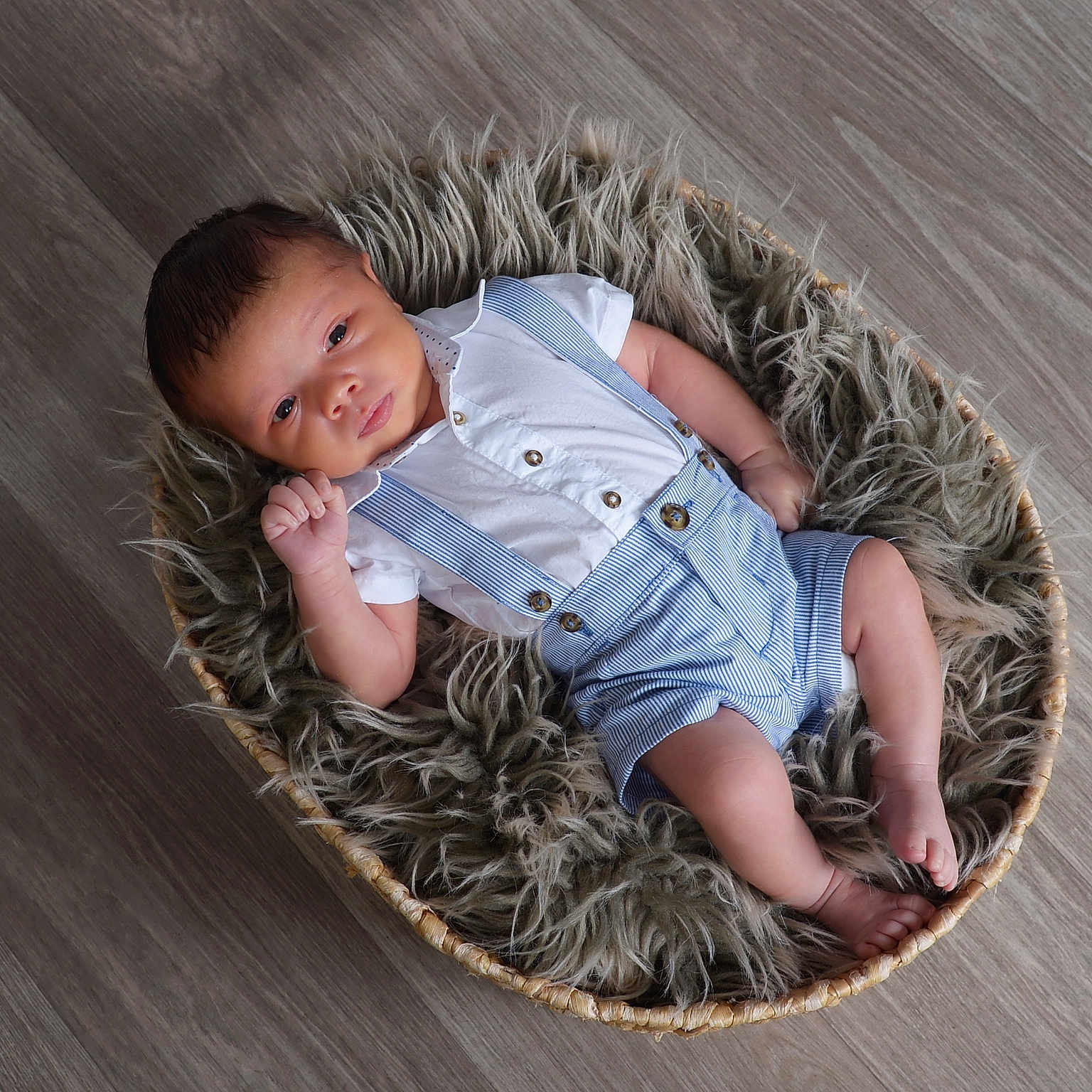 Cobee joined the competition — help win amazing prizes! baby, baby_boy, basket, clothing, cozy, cute, floor, fur, indoors, infant, newborn, person, portrait, relaxing, resting, sleepy, small, suspenders, white_shirt, wood_floor