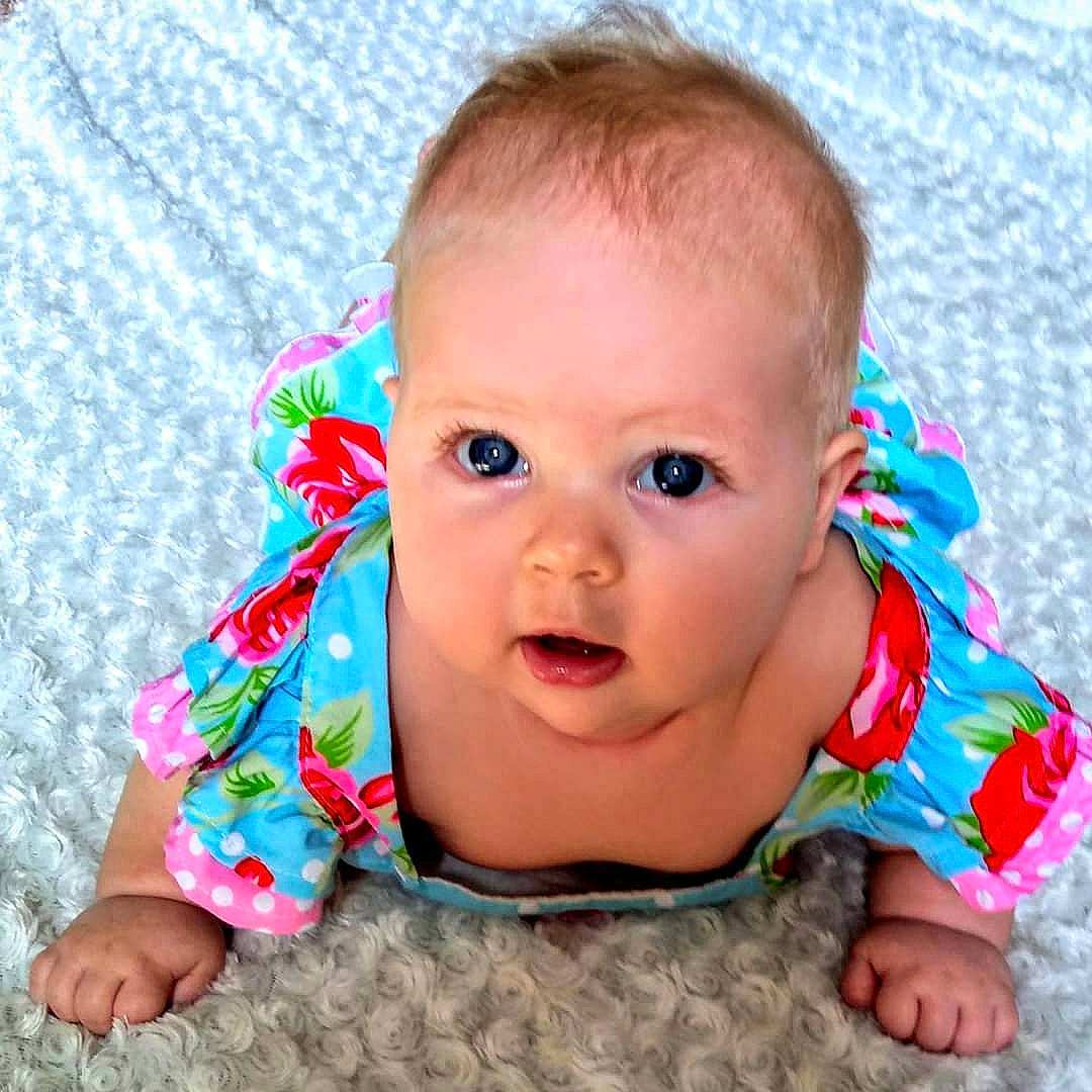 Kathryn is registered to the contest to win money with this photo: baby, beauty, cheek, child, ear, eye, face, facial_expression, forehead, head, lip, mouth, nose, person, pink, play, product, skin, smile, toddler