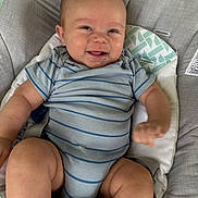 Easton joined the competition — help win amazing prizes! baby, infant, smiling, onesie, striped_clothing, cushion, seat, happy, child, skin, face, arm, leg, indoor, comfort, cute, expression, person, small_child, sitting