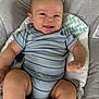 baby, infant, smiling, onesie, striped_clothing, cushion, seat, happy, child, skin, face, arm, leg, indoor, comfort, cute, expression, person, small_child, sitting