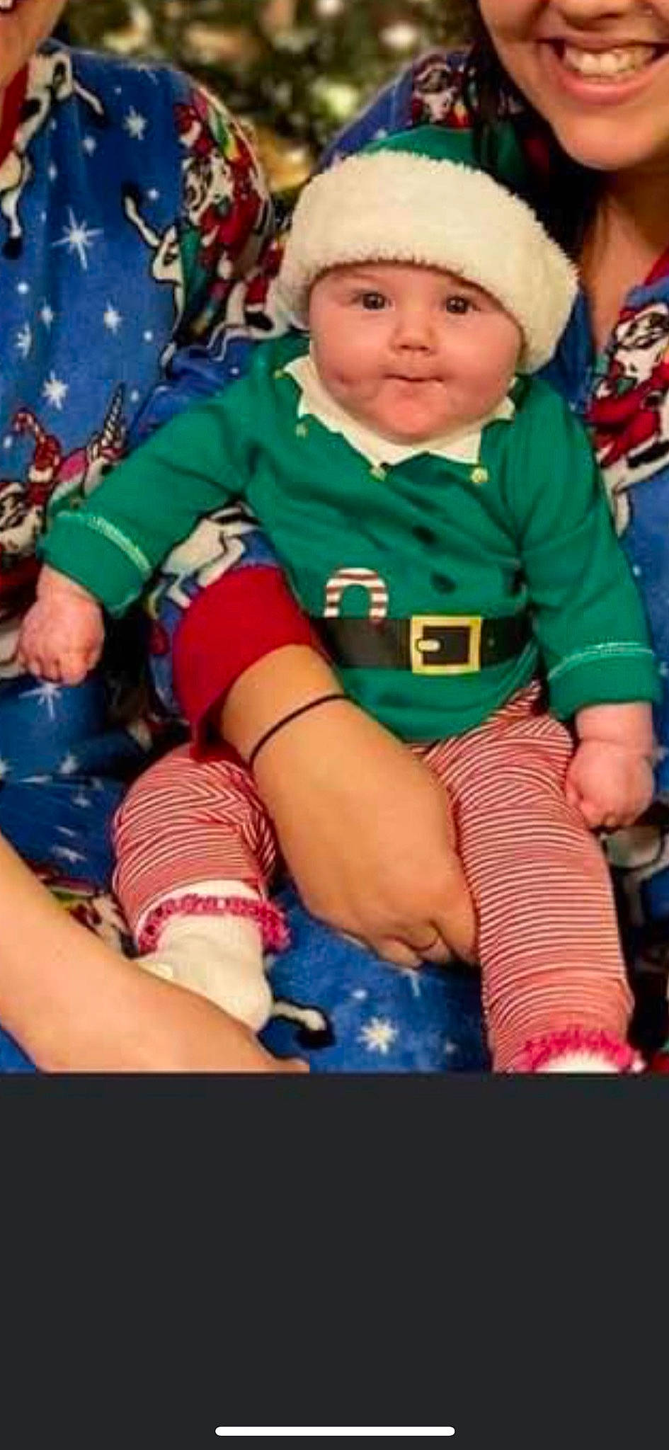 Korra is registered to the contest to win money with this photo: baby, baby_products, baby_toddler_clothing, bonnet, carmine, child, christmas, cool, fictional_character, finger, headwear, holiday, lap, nail, nose, person, play, sitting, sock, thigh