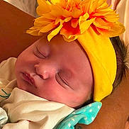 Chole joined the competition — help win amazing prizes! baby, sleeping, headband, flower, yellow, infant, blanket, polka_dot, tattoo, arm, closeup, peaceful, resting, skin, cute, newborn, soft, portrait, child, indoors