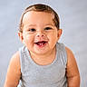 baby, smiling, face, eyes, teeth, skin, child, happy, portrait, sitting, clothing, tank_top, cute, infant, young_child, person, indoors, studio_lighting, head, expression