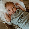 baby, infant, wrapped, blanket, basket, wicker, fur, soft, cozy, lying_down, face, eyes, skin, newborn, cute, peaceful, indoor, portrait, child, resting