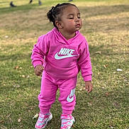 Alaïa joined the competition — help win amazing prizes! toddler, child, pink, nike, tracksuit, outdoor, grass, closed_eyes, shoes, sneakers, person, young_child, park, daylight, casual_clothing, standing, nature, cute, fashion, calm